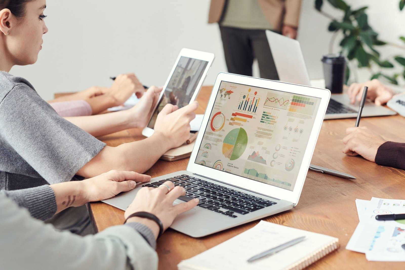 Marketing team reviewing local search rankings and analytics on a laptop in an office