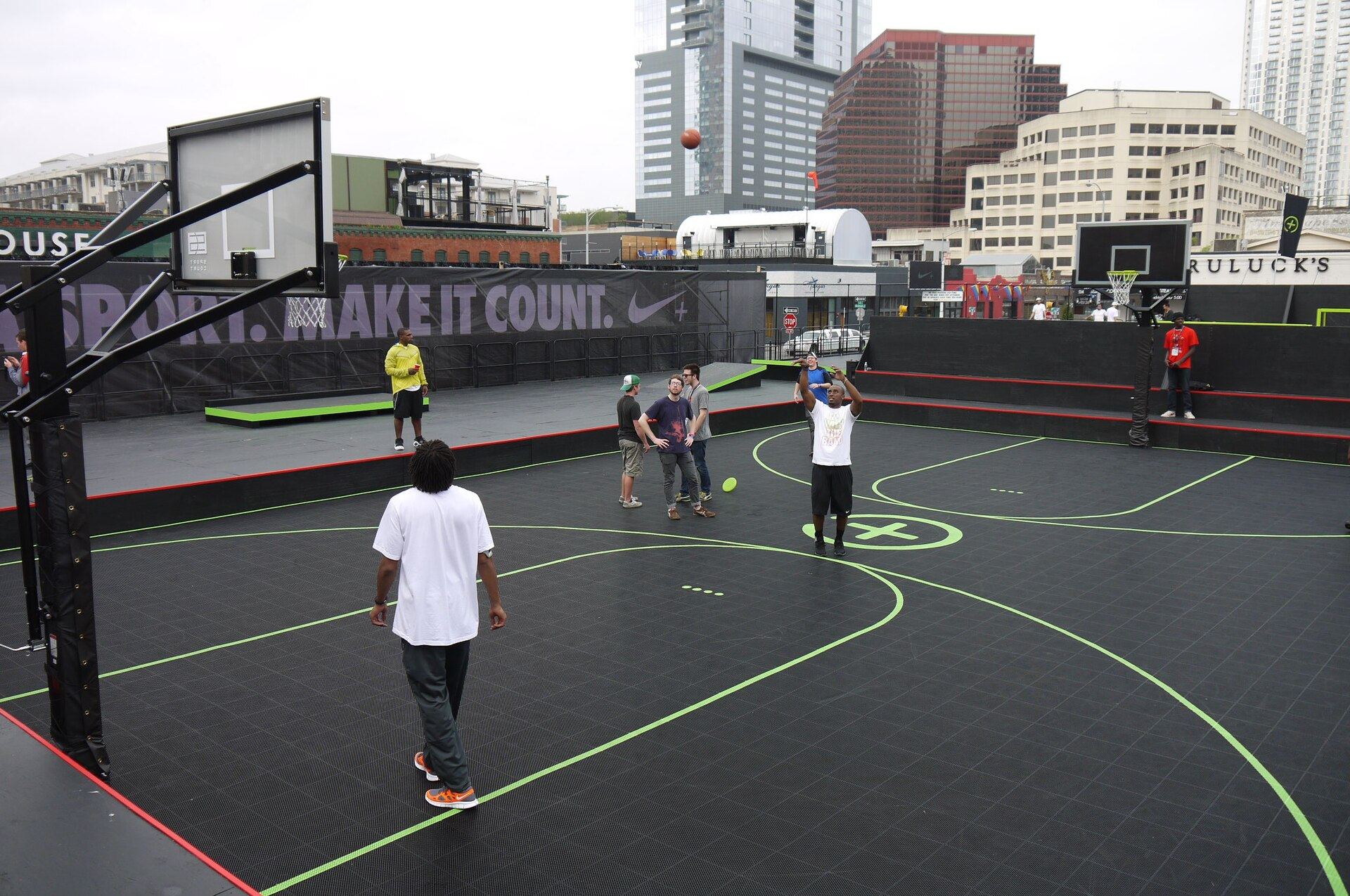 Nike’s pop-up basketball court at SXSW, with people shooting hoops in the open air
