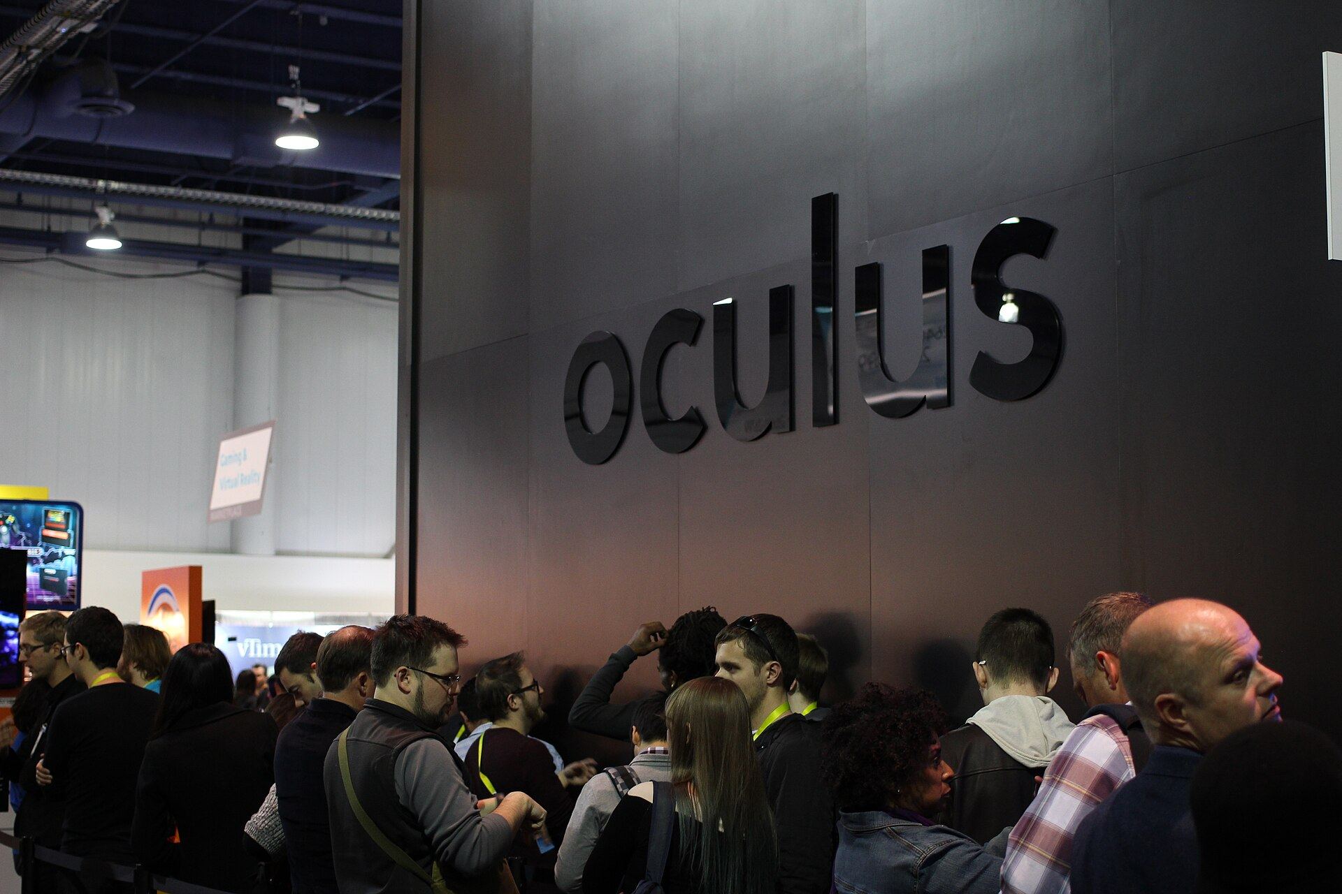 Oculus's stand at CES, a dark monolith wall with visitors queuing alongside